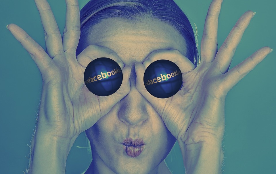 facebook logo in the eyes of a girl